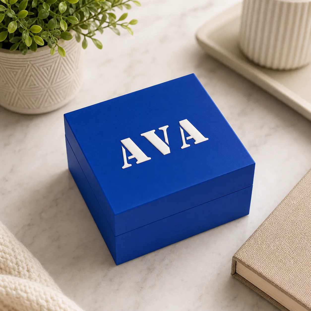 Personalized blue 3D printed keepsake box with raised white name lettering
